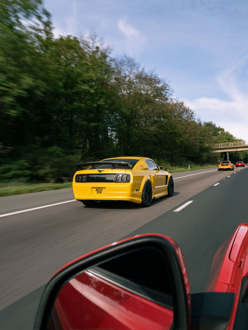 Yellow Ford Mustang from behind