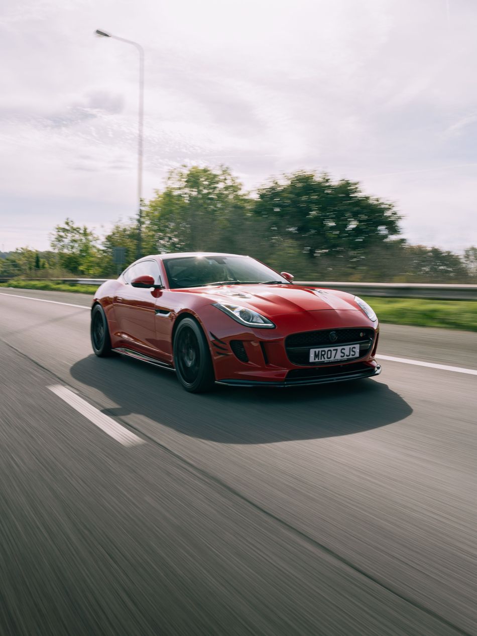 Red Jaguar F-Type on the road
